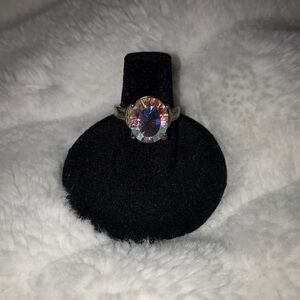 Iridescent crystal set in sterling silver ring with whale tail bezel